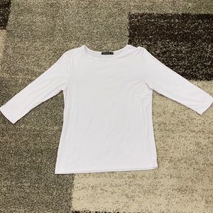 Nuggles brand white stretchy layering top. Brand new, never worn. 3/4 sleeve.